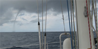 Waterspout Near a Sailboat
